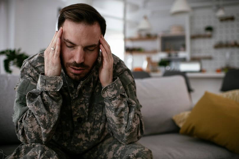 man touching his head alzheimer's study volunteers
