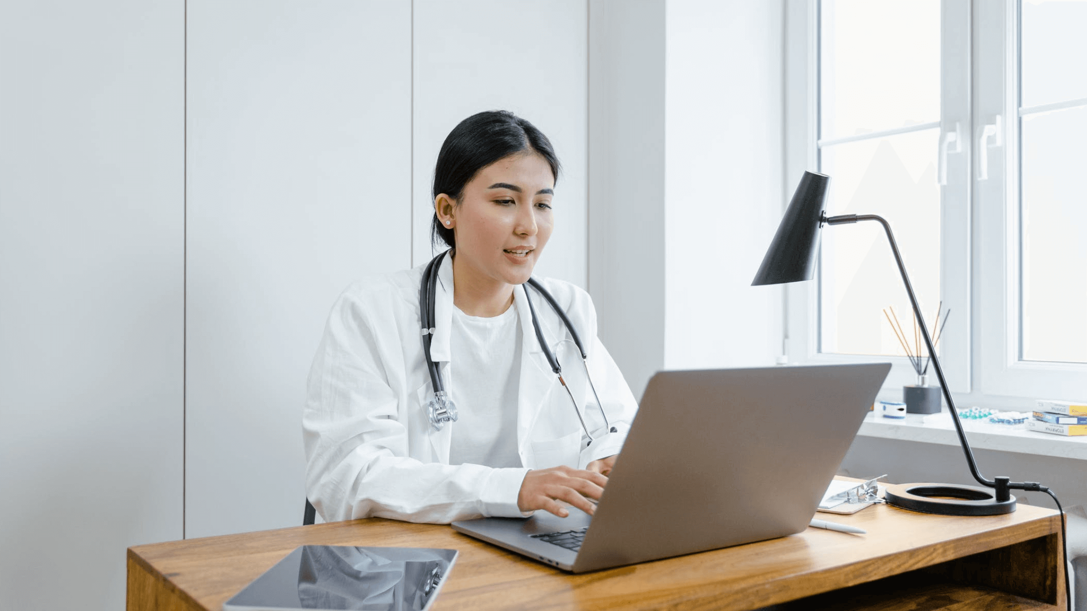 medical professional in front of her laptop multiple sclerosis case study