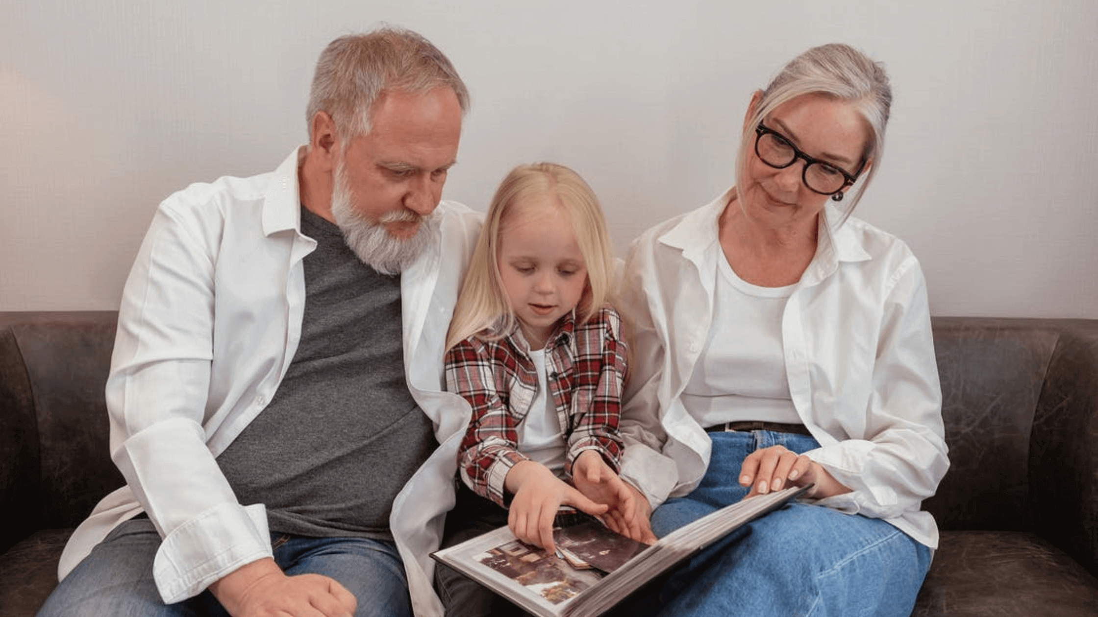 old couple with a little girl looking at some photos alzheimer's study