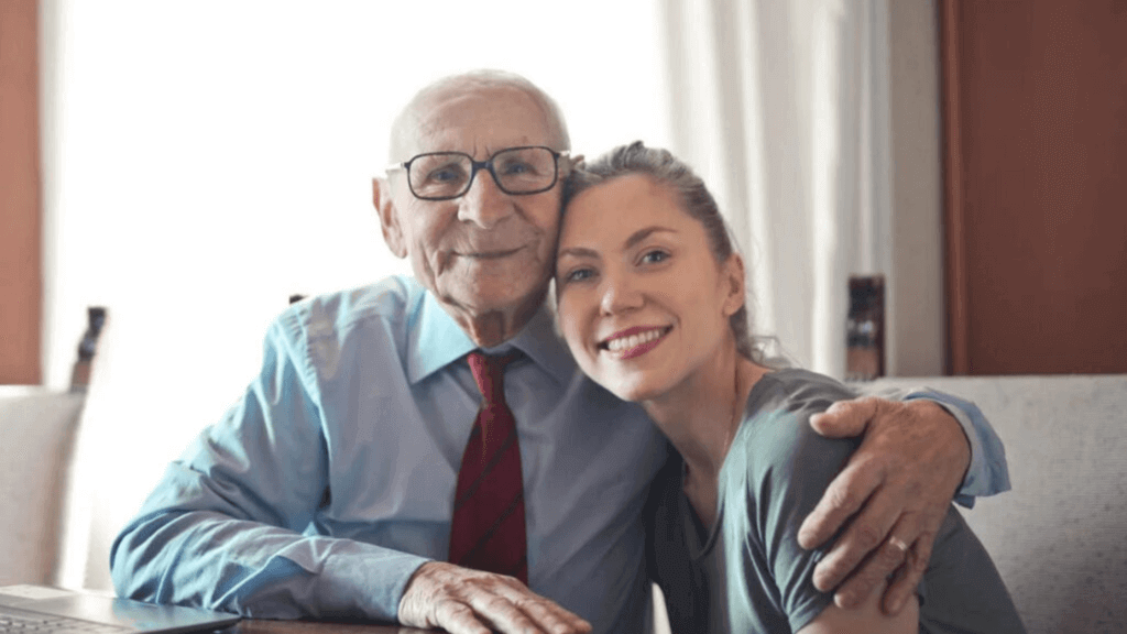smiling old man with a lady beside alzheimer's study