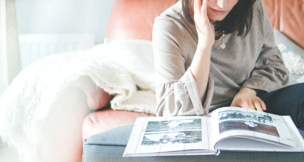 woman sitting reading books bradenton research center
